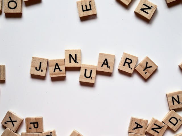 January spelled out in scrabble tiles